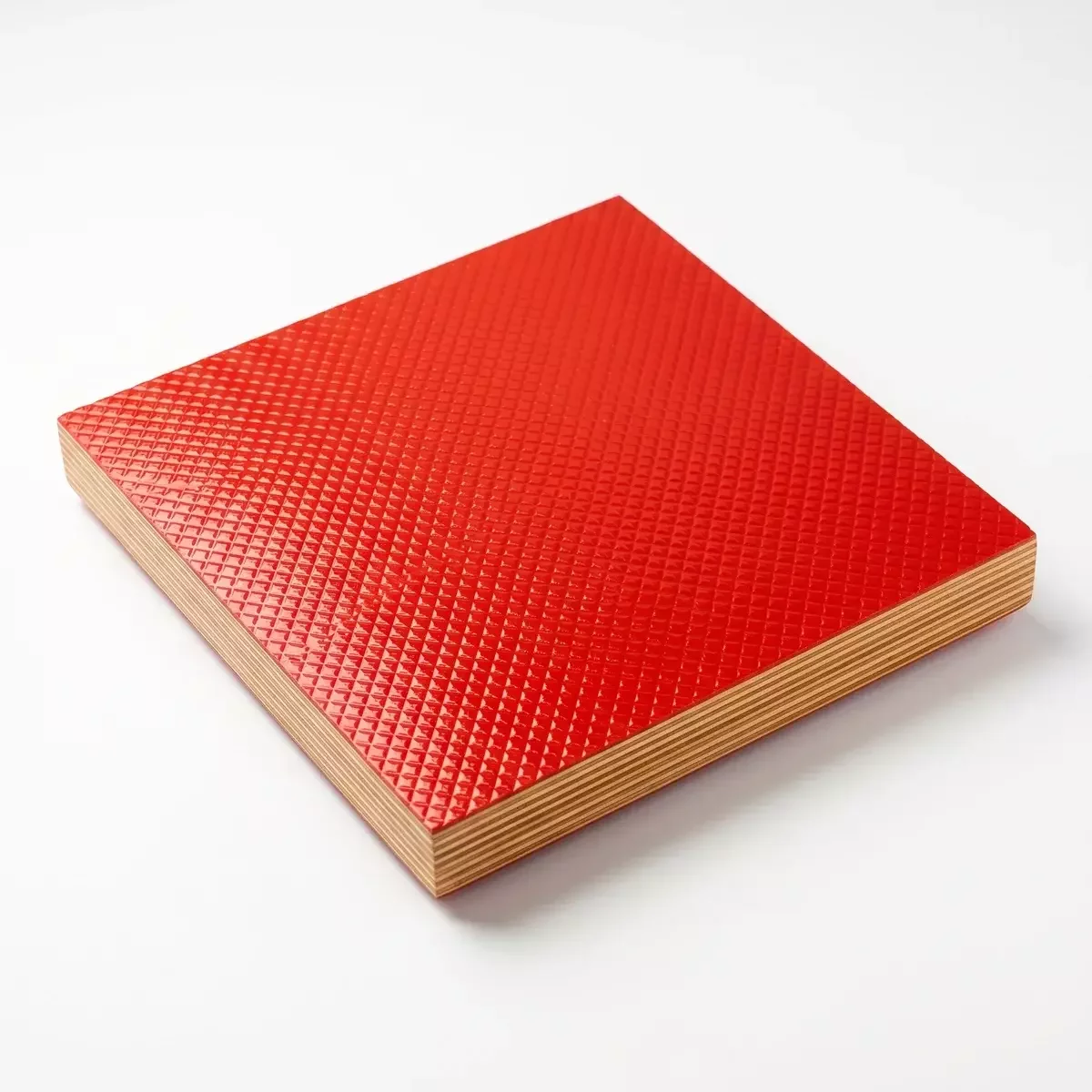 Chequered anti-skid plywood surface close-up showing diamond pattern